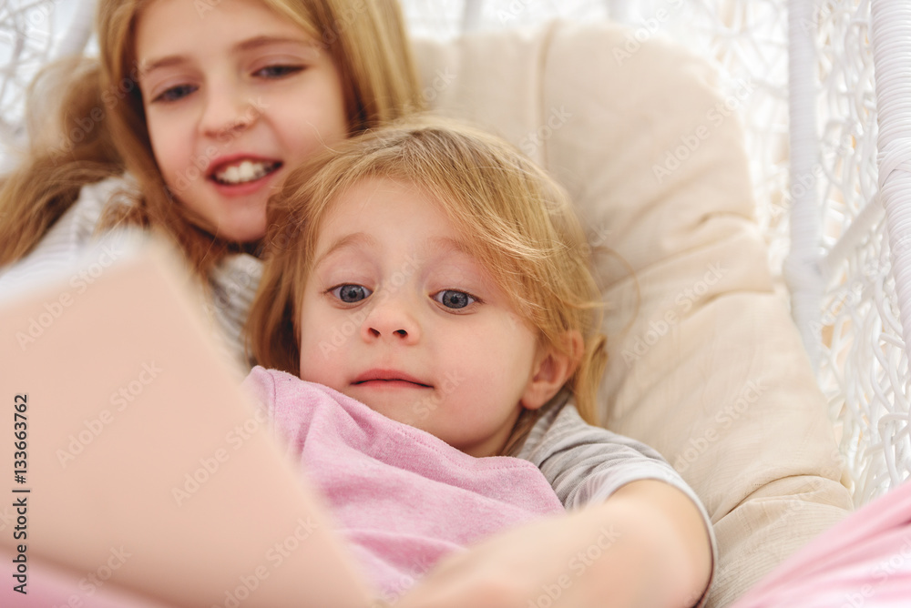 Cheerful kids reading fairy tale Cheerful kids reading fairy tale