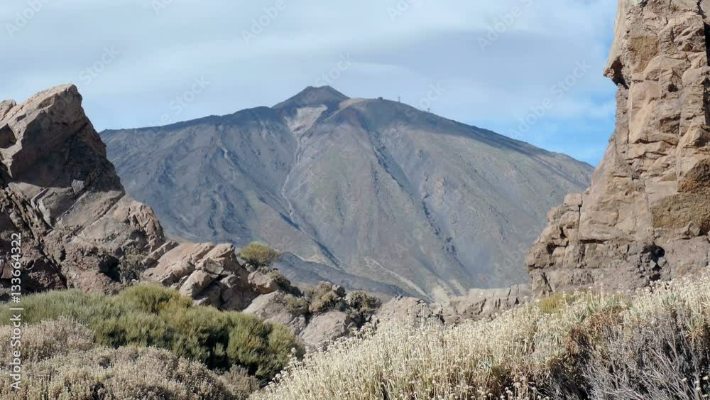 View to the volcano framed by rock formations
View to the volcano framed by rock formations