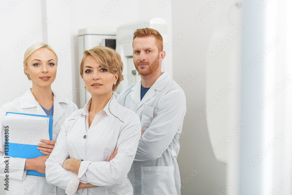 Smiling doctors working as team