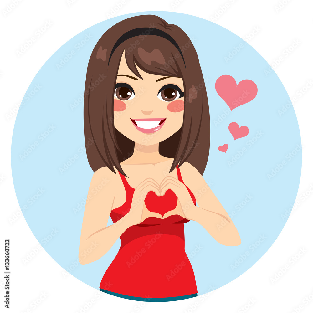 Beautiful brunette girl making heart shape with hands on Saint Valentine day Beautiful brunette girl making heart shape with hands on Saint Valentine day
