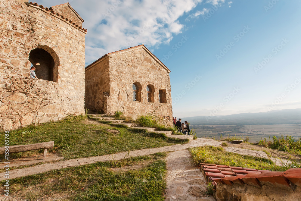 Hill top with people discovering the ancient Christian monastery Nekresi y