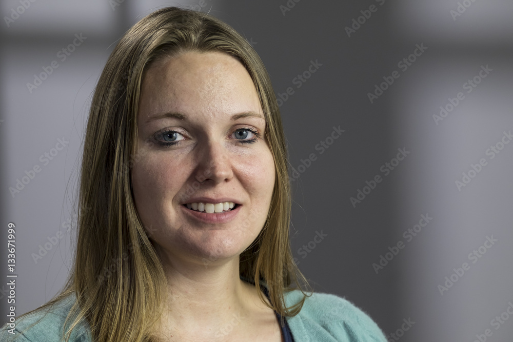 Portrait of a young woman looking at the camera Portrait of a young woman looking at the camera