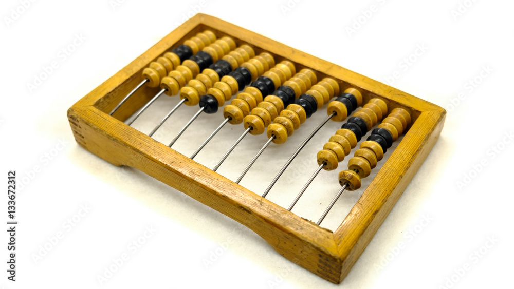 Old wooden abacus on a light background Old wooden abacus on a light background