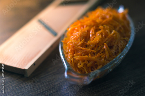 Grated carrot on a wooden board