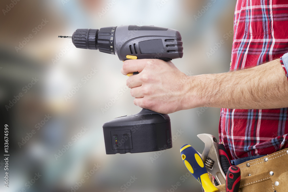 hand with the drill or screwdriver isolated, DIY and tools hand with the drill or screwdriver isolated, DIY and tools