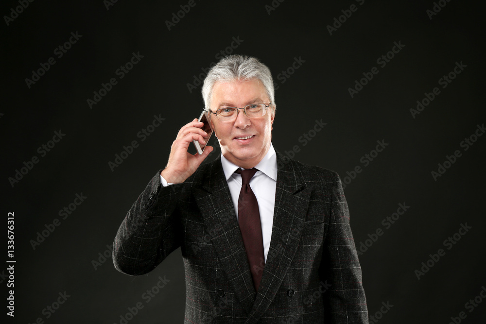 Senior businessman on black background Senior businessman on black background