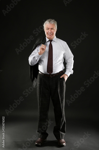 Senior businessman holding ...