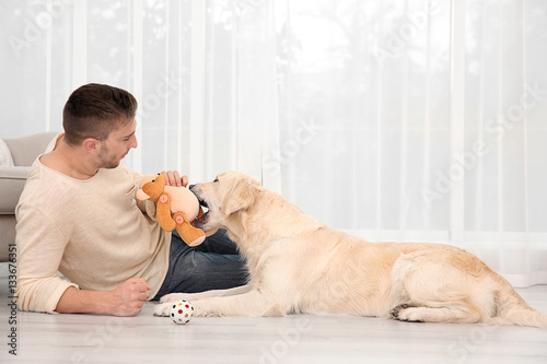 Handsome man playing with l...
