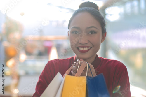 Holding thousands shopping bags