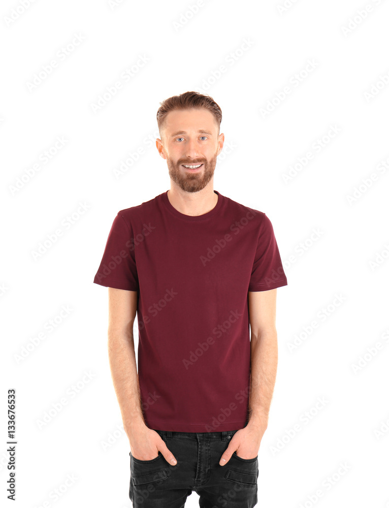 Young handsome man in claret red T-shirt isolated on white