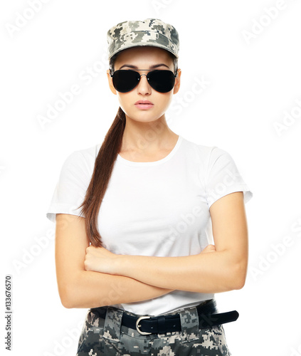 Pretty female soldier with sunglasses, on white background © Africa Studio