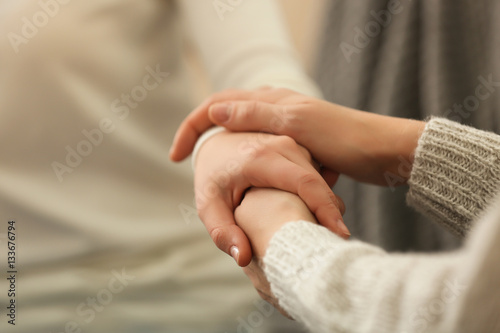 Fotografie, Obraz Hands of young woman countenancing depressed friend, closeup