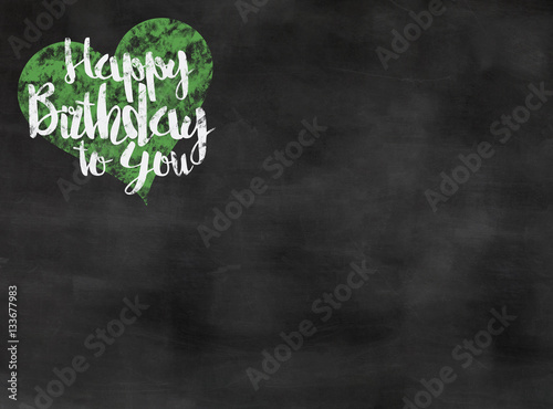 words happy birthday to you written on blackboard with green heart, copy space