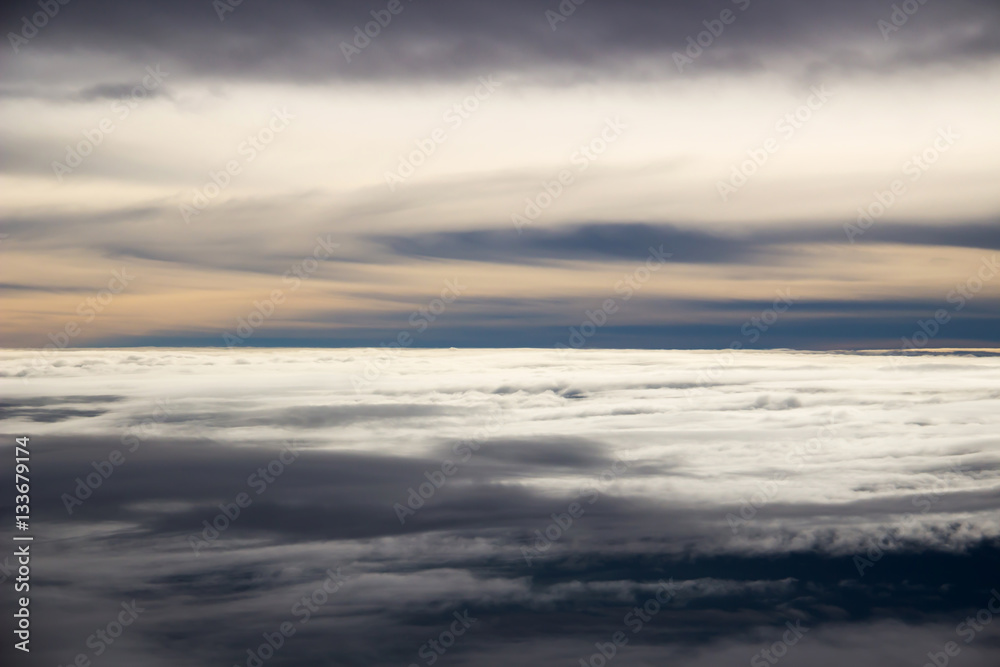 Fototapeta premium Spectacular view of carpet clouds from airplane