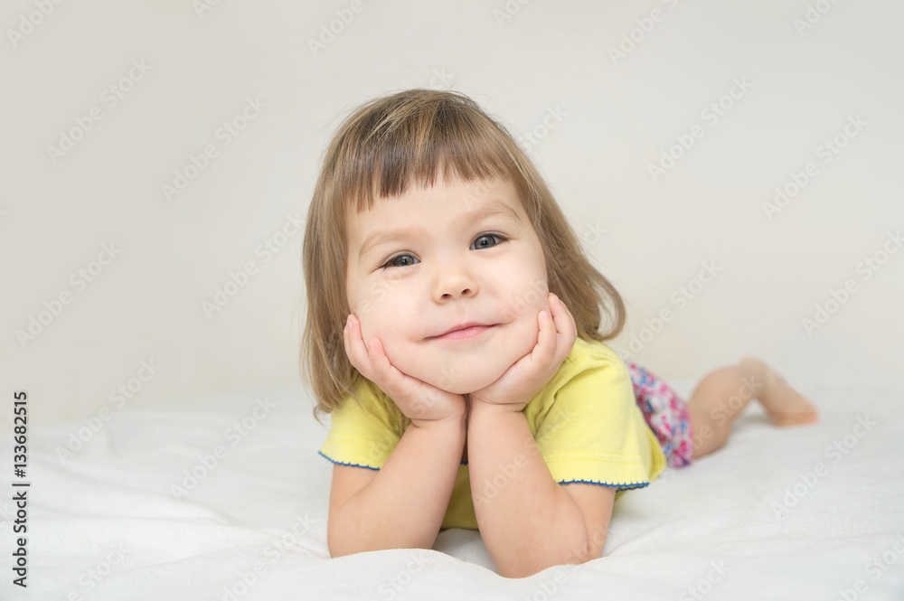 smiling happy little girl portrait with cute cheeks isolated smiling happy little girl portrait with cute cheeks isolated