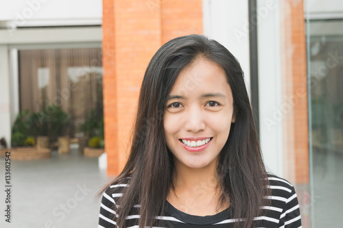 Beautiful asian woman smiling and happy for new project. Smart work process concept.
