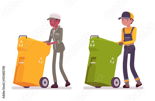 Male and female waste collectors in uniform pushing trash bins