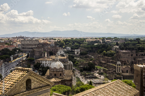 Rome overview with monument and several streets, roofs, domes, Coliseum, Imperial Forum, Rome, Italy