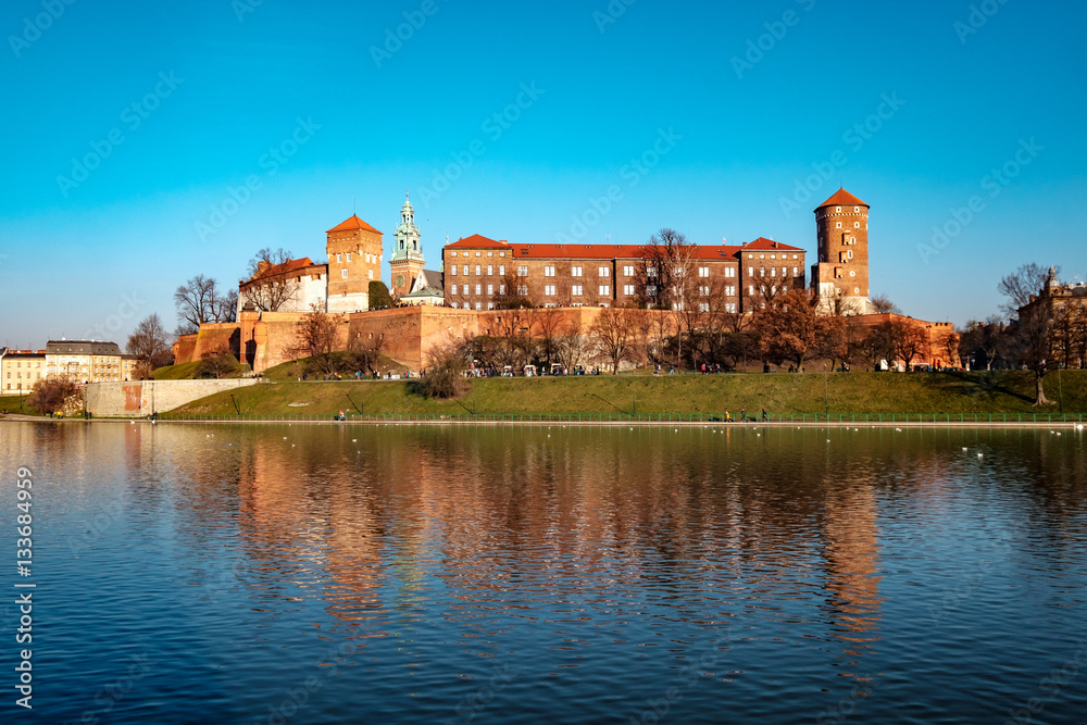 Famous landmark Wawel castle seen from Vistula, Krakow, Poland.
