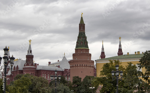 View of Nikolskaya Tower and Red square area from Alexandrovsky Garden in Moscow. Landmark gated defense tower built in 1492  known for the small star atop its steeple. It s cloudy autumn day.