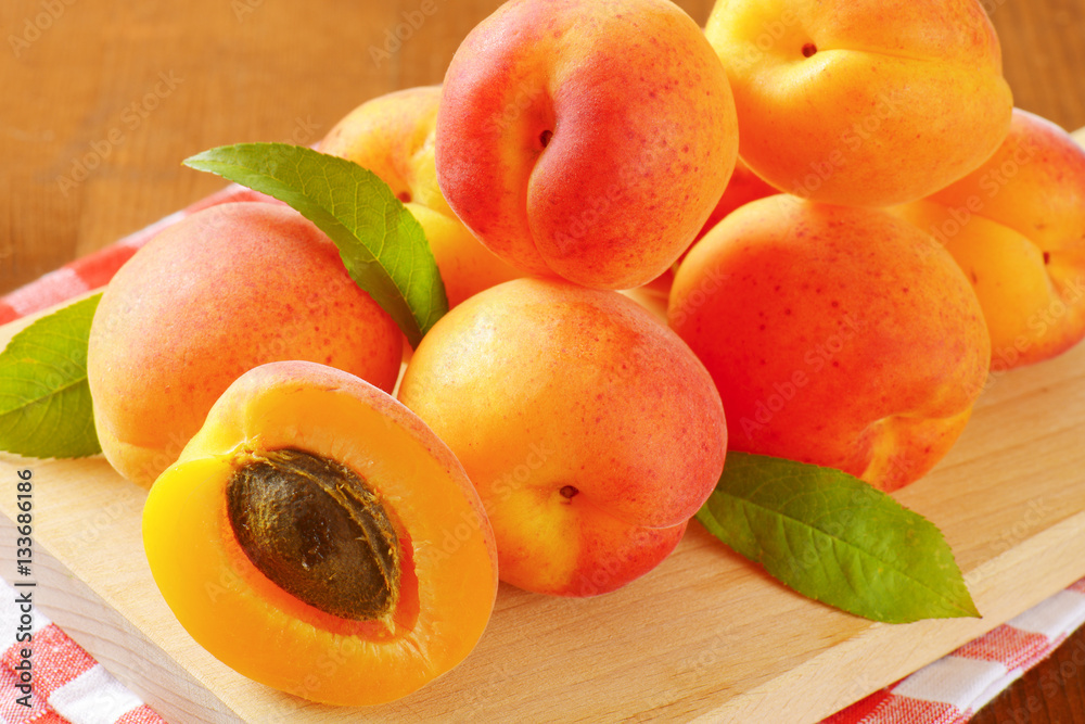 ripe apricots with leaves ripe apricots with leaves