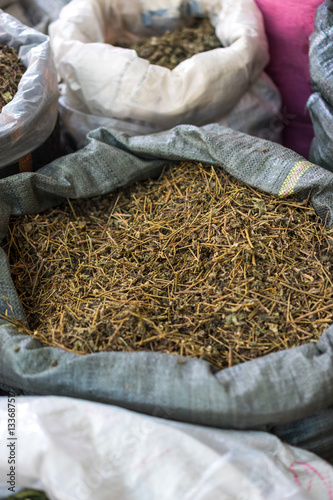 Bags of dried herbal tea for sale at city market, Vietnam.