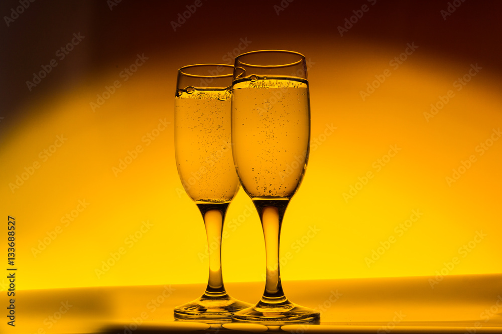 Two champagne glass on yellow background