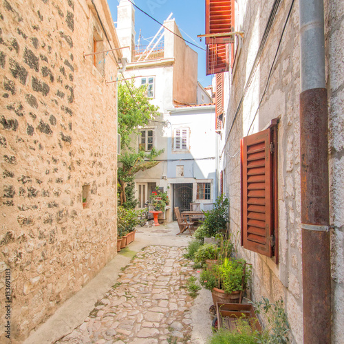      Narrow street and old houses in old town in Cres  Croatia  Mediterranean ambient 