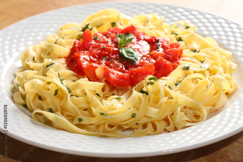 Fresh made pasta with simple tomatoes sauce Fresh made pasta with simple tomatoes sauce