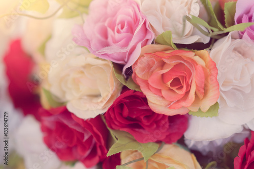 Decoration artificial flower on table ( Filtered image processed