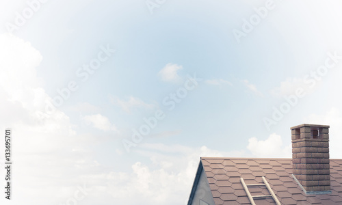 House roof as concept of suburbian real estate and construction.