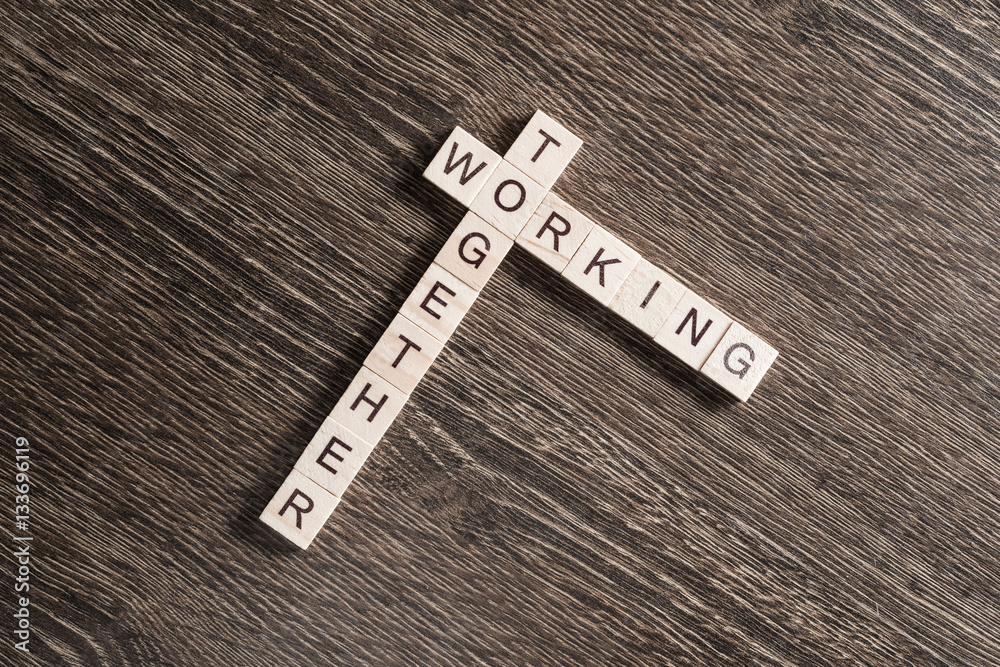 Conceptual business keywords on table with elements of game making crossword Conceptual business keywords on table with elements of game making crossword
