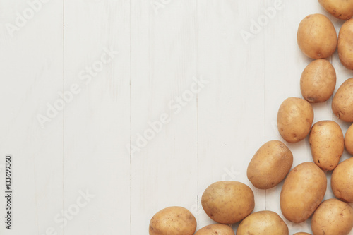 Agricultural rustic background - potato harvest on a wooden white table