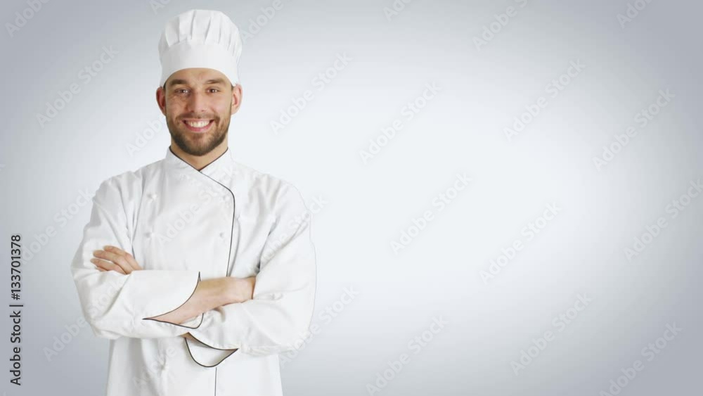 Mid Shot of a Handsome Chef Crossing Arms and Smiling. Shot with White Background. Shot on RED Cinema Camera 4K (UHD). Mid Shot of a Handsome Chef Crossing Arms and Smiling. Shot with White Background. Shot on RED Cinema Camera 4K (UHD).