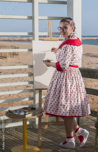 Cute pinup girl in the beach