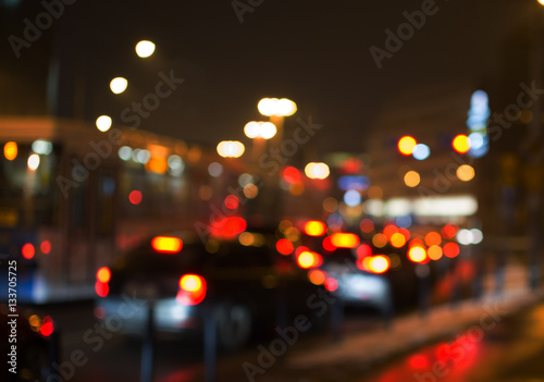 Night road in the city, cars light in traffic jams, defocused,