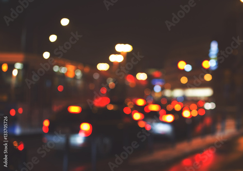 Night road in the city, cars light in traffic jams, defocused, v