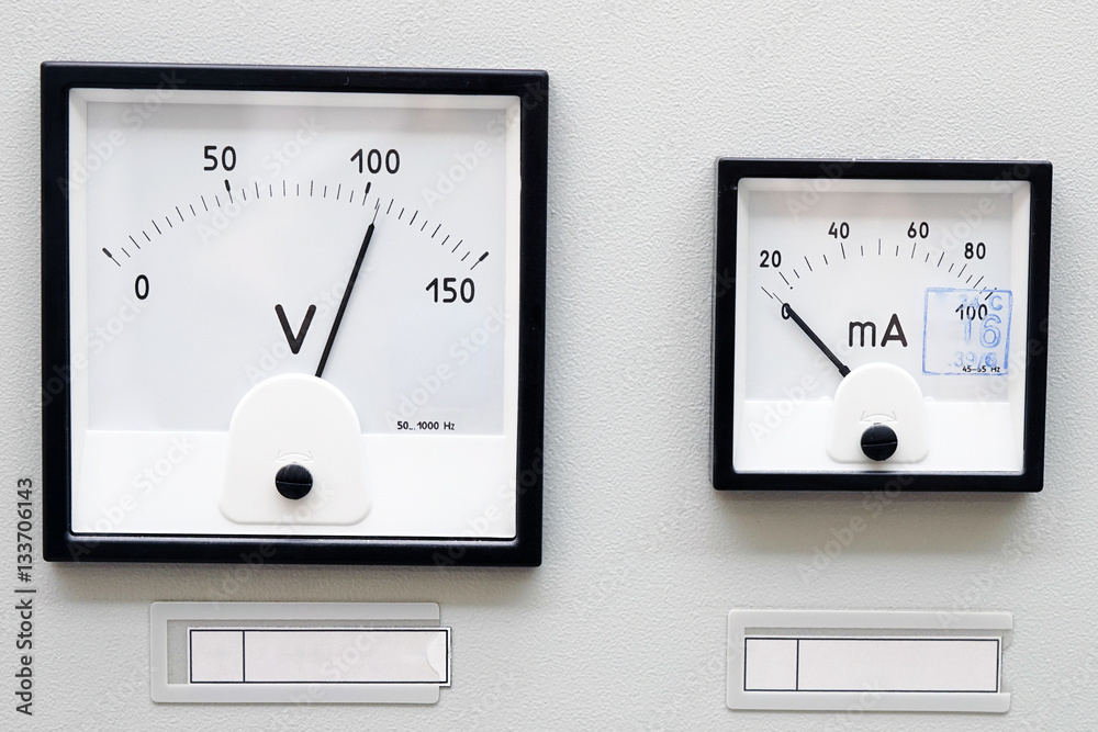 Two volt meter on the metal panel electrical shield. Two volt meter on the metal panel electrical shield.