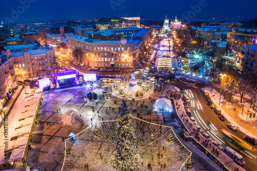 KYIV, UKRAINE - JANUARY 15, 2017: Christmas market on Sophia Square in Kyiv, Ukraine. Main Kyiv's New Year tree and Saint Sophia Cathedral on the background