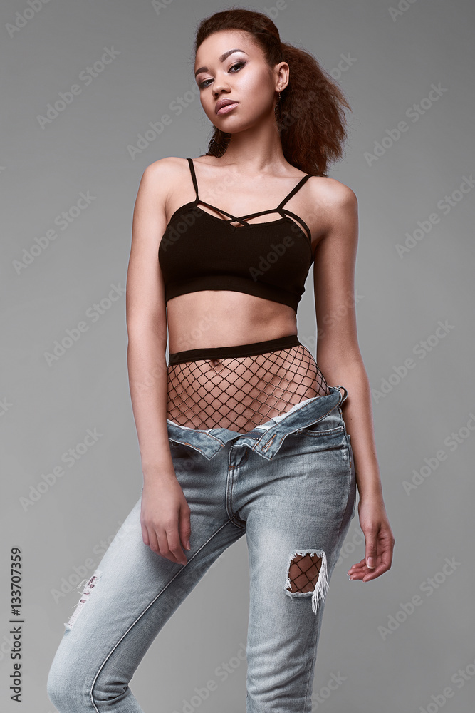 Glamor elegant black woman model in jeans