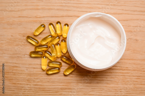 Set of care cream and Fish oil capsules with omega 3 and vitamin D. Beauty and health concept