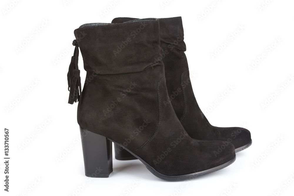Black ankle boots with a tassel isolated on white Black ankle boots with a tassel isolated on white