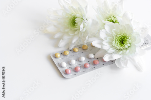 concept of female contraception on white background