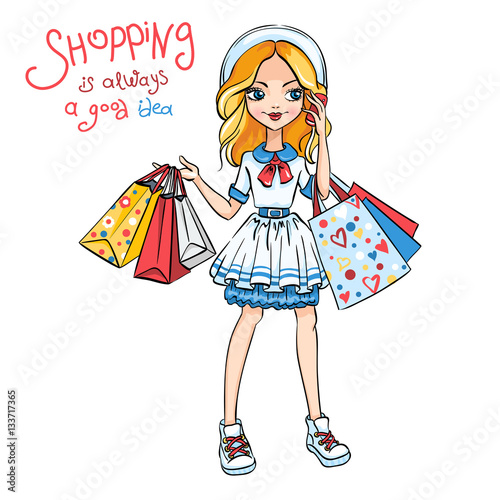 Cute fashion girl in dress and hat with shopping