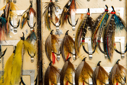 Cropped shot of salmon flys in a flybox photo