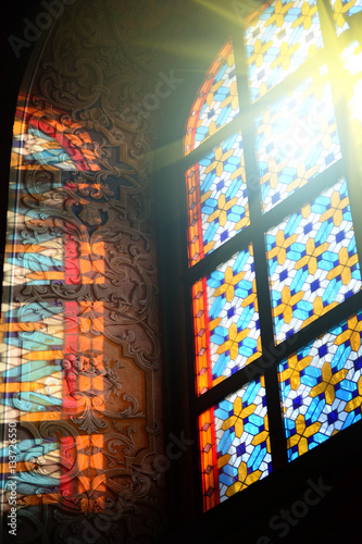 The Bernardine church and monastery (church of St. Andrew) in Lviv, Ukraine. Church and fortification was built in 1600-1630. Beautiful stained glass window with sunlight. Religion and art concept.