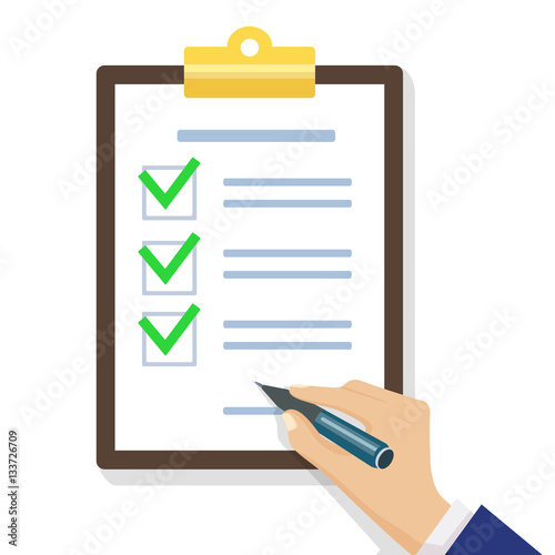 Hand filling checklist on clipboard