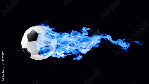 Flying football or soccer ball on fire. Isolated on black background.