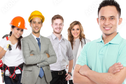 young casual man in front of people in different kind of profess