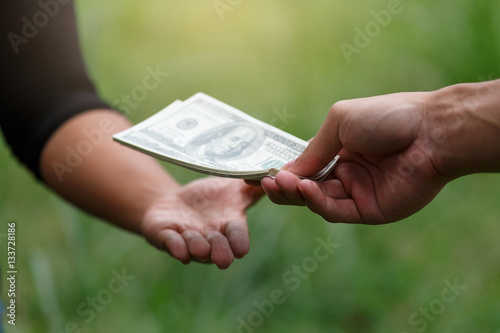 Hand receiving money, US dollars
